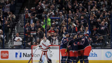 Jan 7, 2023; Columbus, Ohio, USA; Columbus Blue Jackets right wing Kirill Marchenko (right) celebrates with teammates after scoring his hat-trick goal against the Carolina Hurricanes in the third period at Nationwide Arena. Mandatory Credit: Aaron Doster-USA TODAY Sports