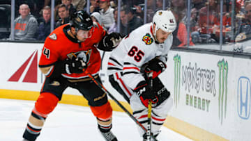 ANAHEIM, CA - NOVEMBER 03: Michael Del Zotto #44 of the Anaheim Ducks and Erik Gustafsson #56 of the Chicago Blackhawks battle for the puck during the second period of the game at Honda Center on November 3, 2019 in Anaheim, California. (Photo by Debora Robinson/NHLI via Getty Images)