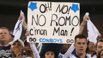 Dec 29, 2013; Arlington, TX, USA; Dallas Cowboys fan holds up a sign about missing Tony Romo (not pictured) during the second half against the Philadelphia Eagles at AT&T Stadium. Mandatory Credit: Matthew Emmons-USA TODAY Sports