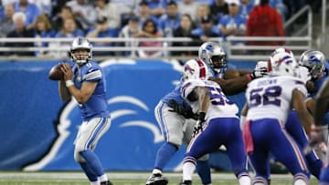 Oct 5, 2014; Detroit, MI, USA; Detroit Lions quarterback Matthew Stafford (9) looks for an open man down field during the fourth quarter against the Buffalo Bills at Ford Field. Bills beat the Lions 17-14. Mandatory Credit: Raj Mehta-USA TODAY Sports
