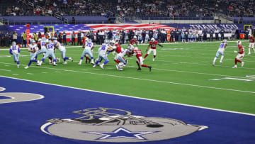 ARLINGTON, TEXAS - OCTOBER 19: Andy Dalton #14 of the Dallas Cowboys rolls out to pass against the Arizona Cardinals during the first quarter at AT&T Stadium on October 19, 2020, in Arlington, Texas. (Photo by Ronald Martinez/Getty Images)