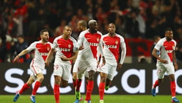 MONACO - MARCH 15: Kylian Mbappe of AS Monaco (29) celebrates as he scores their first goal with team mates during the UEFA Champions League Round of 16 second leg match between AS Monaco and Manchester City FC at Stade Louis II on March 15, 2017 in Monaco, Monaco. (Photo by Michael Steele/Getty Images)