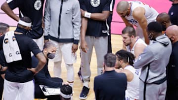 MIAMI, FLORIDA - JANUARY 28: Head coach Tyronn Lue of the LA Clippers talks with his team during a timeout against the Miami Heat at American Airlines Arena on January 28, 2021 in Miami, Florida. NOTE TO USER: User expressly acknowledges and agrees that, by downloading and or using this photograph, User is consenting to the terms and conditions of the Getty Images License Agreement. (Photo by Michael Reaves/Getty Images)