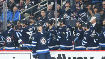 May 1, 2022; Winnipeg, Manitoba, CAN; Winnipeg Jets forward Morgan Barron (36) is congratulated by his team mates on his goal against the Seattle Kraken during the first period at Canada Life Centre. Mandatory Credit: Terrence Lee-USA TODAY Sports
