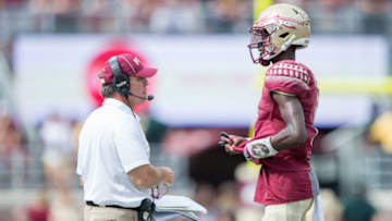 TALLAHASSEE, FL - OCTOBER 21: Head coach Jimbo Fisher of the Florida State Seminoles talks to quarterback James Blackman
