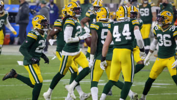 GREEN BAY, WISCONSIN - DECEMBER 19: Kevin King #20 of the Green Bay Packers celebrates with teammates after recovering a fumble in the second quarter against the Carolina Panthers at Lambeau Field on December 19, 2020 in Green Bay, Wisconsin. (Photo by Dylan Buell/Getty Images)