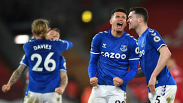 LIVERPOOL, ENGLAND - FEBRUARY 20: Ben Godfrey and Michael Keane of Everton celebrate following their team's victory in the Premier League match between Liverpool and Everton at Anfield on February 20, 2021 in Liverpool, England. Sporting stadiums around the UK remain under strict restrictions due to the Coronavirus Pandemic as Government social distancing laws prohibit fans inside venues resulting in games being played behind closed doors. (Photo by Paul Ellis - Pool/Getty Images)