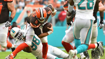 Sep 25, 2016; Miami Gardens, FL, USA; Miami Dolphins defensive end Jason Jones (98) brings down Cleveland Browns quarterback Cody Kessler (6) during the first half at Hard Rock Stadium. Mandatory Credit: Jasen Vinlove-USA TODAY Sports