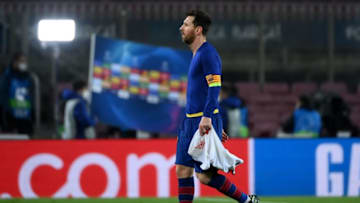 Barcelona's Argentinian forward Lionel Messi walks off the pitch at the end of the UEFA Champions League round of 16 first leg football match between FC Barcelona and Paris Saint-Germain (Photo by LLUIS GENE/AFP via Getty Images)