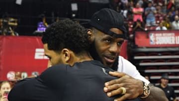 LAS VEGAS, NV - JULY 15: LeBron James (R) of the Los Angeles Lakers hugs Josh Hart #5 of the Lakers after he played in a quarterfinal game of the 2018 NBA Summer League against the Detroit Pistons at the Thomas & Mack Center on July 15, 2018 in Las Vegas, Nevada. The Lakers defeated the Pistons 101-78. NOTE TO USER: User expressly acknowledges and agrees that, by downloading and or using this photograph, User is consenting to the terms and conditions of the Getty Images License Agreement. (Photo by Ethan Miller/Getty Images)