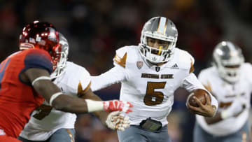 TUCSON, AZ - NOVEMBER 25: Quarterback Manny Wilkins