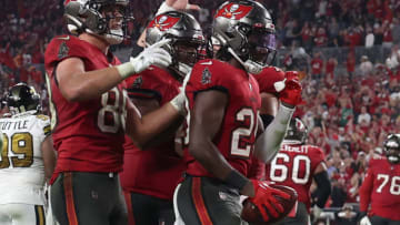 TAMPA, FLORIDA - DECEMBER 05: Rachaad White #29 of the Tampa Bay Buccaneers celebrates with his teammates after scoring a touchdown against the New Orleans Saints late in the fourth quarter during the game at Raymond James Stadium on December 05, 2022 in Tampa, Florida. The Tampa Bay Buccaneers defeated the New Orleans Saints with a score of 17 to 16. (Photo by Mike Carlson/Getty Images)