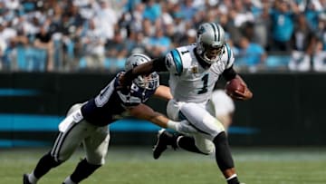 CHARLOTTE, NC - SEPTEMBER 09: Cam Newton #1 of the Carolina Panthers runs the ball against Sean Lee #50 of the Dallas Cowboys in the first quarter during their game at Bank of America Stadium on September 9, 2018 in Charlotte, North Carolina. (Photo by Streeter Lecka/Getty Images)