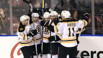 Mar 7, 2016; Sunrise, FL, USA; Boston Bruins right wing Lee Stempniak (20) celebrates his game winning goal with left wing Brad Marchand (63) center Ryan Spooner (51) center Landon Ferraro (29) and right wing Jimmy Hayes (11) in overtime against the Florida Panthers at BB&T Center. The Boston Bruins won 5-4. Mandatory Credit: Robert Mayer-USA TODAY Sports