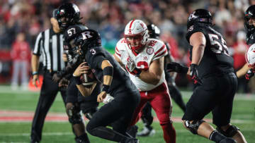 Oct 7, 2022; Piscataway, New Jersey, USA; Rutgers Scarlet Knights quarterback Evan Simon (3) scrambles as Nebraska Cornhuskers defensive lineman Colton Feist (82) pursues (Vincent Carchietta-USA TODAY Sports)