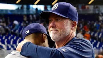 Aug 28, 2016; Miami, FL, USA; San Diego Padres bench coach Mark McGwire (right) celebrates with Padres starting pitcher Luis Perdomo (left) after the Padres defeated the Miami Marlins 3-1 at Marlins Park. Mandatory Credit: Steve Mitchell-USA TODAY Sports