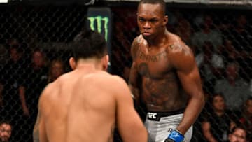 LAS VEGAS, NV - JULY 06: (R-L) Israel Adesanya of Nigeria battles Brad Tavares in their middleweight bout during The Ultimate Fighter Finale event inside The Pearl concert theater at Palms Casino Resort on July 6, 2018 in Las Vegas, Nevada. (Photo by Jeff Bottari/Zuffa LLC/Zuffa LLC via Getty Images)