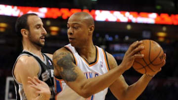 May 25, 2014; Oklahoma City, OK, USA; Oklahoma City Thunder forward Caron Butler (2) handles the ball against San Antonio Spurs guard Manu Ginobili (20) during the second quarter in game three of the Western Conference Finals of the 2014 NBA Playoffs at Chesapeake Energy Arena. Mandatory Credit: Mark D. Smith-USA TODAY Sports