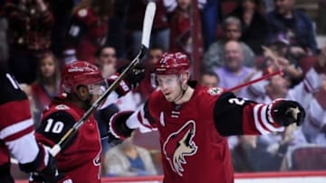 Feb 15, 2016; Glendale, AZ, USA; Arizona Coyotes defenseman Oliver Ekman-Larsson (23) celebrates with left wing Anthony Duclair (10) after scoring a goal in the second period against the Montreal Canadiens at Gila River Arena. Mandatory Credit: Matt Kartozian-USA TODAY Sports