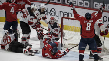 Mar 25, 2021; Washington, District of Columbia, USA; Washington Capitals left wing Alex Ovechkin (8) celebrates after Washington Capitals center Evgeny Kuznetsov (92) not pictured scores a goal against New Jersey Devils goaltender Mackenzie Blackwood (29) during the second period at Capital One Arena. Mandatory Credit: Scott Taetsch-USA TODAY Sports