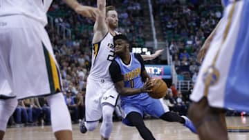 Nov 23, 2016; Salt Lake City, UT, USA; Denver Nuggets guard Emmanuel Mudiay (0) drives to the hoop against Utah Jazz forward Gordon Hayward (20) in the second quarter at Vivint Smart Home Arena. Mandatory Credit: Jeff Swinger-USA TODAY Sports