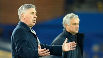 Everton's Italian head coach Carlo Ancelotti (L) and Tottenham Hotspur's Portuguese head coach Jose Mourinho react during the English Premier League football match between Everton and Tottenham Hotspur at Goodison Park in Liverpool, north west England on April 16, 2021. - RESTRICTED TO EDITORIAL USE. No use with unauthorized audio, video, data, fixture lists, club/league logos or 'live' services. Online in-match use limited to 120 images. An additional 40 images may be used in extra time. No video emulation. Social media in-match use limited to 120 images. An additional 40 images may be used in extra time. No use in betting publications, games or single club/league/player publications. (Photo by PETER POWELL / POOL / AFP) / RESTRICTED TO EDITORIAL USE. No use with unauthorized audio, video, data, fixture lists, club/league logos or 'live' services. Online in-match use limited to 120 images. An additional 40 images may be used in extra time. No video emulation. Social media in-match use limited to 120 images. An additional 40 images may be used in extra time. No use in betting publications, games or single club/league/player publications. / RESTRICTED TO EDITORIAL USE. No use with unauthorized audio, video, data, fixture lists, club/league logos or 'live' services. Online in-match use limited to 120 images. An additional 40 images may be used in extra time. No video emulation. Social media in-match use limited to 120 images. An additional 40 images may be used in extra time. No use in betting publications, games or single club/league/player publications. (Photo by PETER POWELL/POOL/AFP via Getty Images)