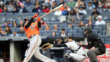 Oct 1, 2016; Bronx, NY, USA; Baltimore Orioles third baseman Manny Machado (13) hits a solo home run to right during the third inning against the New York Yankees at Yankee Stadium. Mandatory Credit: Anthony Gruppuso-USA TODAY Sports