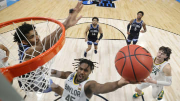 INDIANAPOLIS, INDIANA - MARCH 27: Davion Mitchell #45 of the Baylor Bears goes up for a shot against Jermaine Samuels #23 of the Villanova Wildcats in the second half of their Sweet Sixteen game of the 2021 NCAA Men's Basketball Tournament at Hinkle Fieldhouse on March 27, 2021 in Indianapolis, Indiana. (Photo by Andy Lyons/Getty Images)