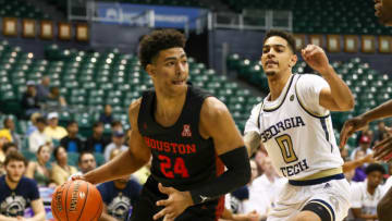 HONOLULU, HI - DECEMBER 23: Quentin Grimes #24 of the Houston Cougars drives the baseline past Michael Devoe #0 of the Georgia Tech Yellow Jackets during the first half of the game at the Stan Sheriff Center on December 23, 2019 in Honolulu, Hawaii. (Photo by Darryl Oumi/Getty Images)