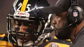 November 18, 2012; Pittsburgh, PA, USA; Pittsburgh Steelers free safety Ryan Clark (25) listens to Steelers head coach Mike Tomlin (right) on the sidelines against the Baltimore Ravens during the second quarter at Heinz Field. The Baltimore Ravens 13-10. Mandatory Credit: Charles LeClaire-USA TODAY Sports
