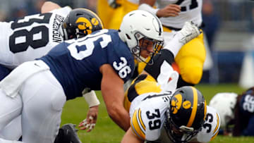 STATE COLLEGE, PA - OCTOBER 27: Nate Wieting #39 of the Iowa Hawkeyes recovers a fumble against Jan Johnson #36 of the Penn State Nittany Lions on October 27, 2018 at Beaver Stadium in State College, Pennsylvania. (Photo by Justin K. Aller/Getty Images)