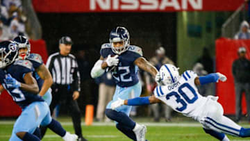 NASHVILLE, TN - DECEMBER 30: Derrick Henry #22 of the Tennessee Titans blocks George Odum #30 of the Indianapolis Colts while running with the ball during the third quarter at Nissan Stadium on December 30, 2018 in Nashville, Tennessee. (Photo by Frederick Breedon/Getty Images)