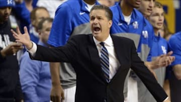 Dec 28, 2013; Lexington, KY, USA; Kentucky Wildcats head coach John Calipari reacts during the first half against the Louisville Cardinals at Rupp Arena. Mandatory Credit: Jamie Rhodes-USA TODAY Sports