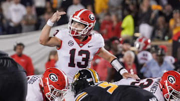 Oct 1, 2022; Columbia, Missouri, USA; Georgia Bulldogs quarterback Stetson Bennett (13) gestures on the line of scrimmage against the Missouri Tigers during the second half at Faurot Field at Memorial Stadium. Mandatory Credit: Denny Medley-USA TODAY Sports