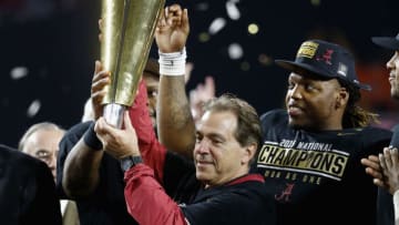 GLENDALE, AZ - JANUARY 11: Head coach Nick Saban of the Alabama Crimson Tide celebrates by hoisting the College Football Playoff National Championship Trophy after defeating the Clemson Tigers in the 2016 College Football Playoff National Championship Game at University of Phoenix Stadium on January 11, 2016 in Glendale, Arizona. The Crimson Tide defeated the Tigers with a score of 45 to 40. (Photo by Sean M. Haffey/Getty Images)