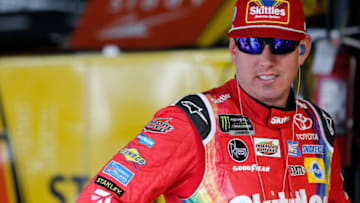 DARLINGTON, SC - AUGUST 31: Kyle Busch, driver of the #18 M&M's White Chocolate Toyota, stands in the garage during practice for the Monster Energy NASCAR Cup Series Bojangles' Southern 500 at Darlington Raceway on August 31, 2018 in Darlington, South Carolina. (Photo by Brian Lawdermilk/Getty Images)
