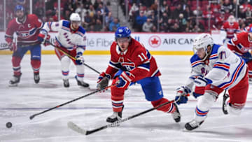 MONTREAL, QC - FEBRUARY 27: Brendan Gallagher #11 of the Montreal Canadiens and Tony DeAngelo #77 of the New York Rangers skate after the puck during the second period at the Bell Centre on February 27, 2020 in Montreal, Canada. The New York Rangers defeated the Montreal Canadiens 5-2. (Photo by Minas Panagiotakis/Getty Images)