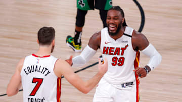LAKE BUENA VISTA, FLORIDA - SEPTEMBER 17: Jae Crowder #99 of the Miami Heat and Goran Dragic #7 of the Miami Heat react after their win over Boston Celtics in Game Two of the Eastern Conference Finals during the 2020 NBA Playoffs at AdventHealth Arena at the ESPN Wide World Of Sports Complex on September 17, 2020 in Lake Buena Vista, Florida. NOTE TO USER: User expressly acknowledges and agrees that, by downloading and or using this photograph, User is consenting to the terms and conditions of the Getty Images License Agreement. (Photo by Kevin C. Cox/Getty Images)