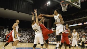 Oct 8, 2014; Jacksonville, FL, USA; New Orleans Pelicans center Alexis Ajinca (42) blocks the shot of Washington Wizards guard Glen Rice (14) during the first quarter at Jacksonville Veterans Memorial Arena. Mandatory Credit: Richard Dole-USA TODAY Sports