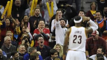 Nov 15, 2014; Cleveland, OH, USA; Cleveland Cavaliers forward LeBron James (23) makes a three-point basket in the first quarter at Quicken Loans Arena. Mandatory Credit: David Richard-USA TODAY Sports