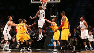 Mar 24, 2016; Brooklyn, NY, USA; Brooklyn Nets guard Sean Kilpatrick (6) reaches for the net during the first quarter against the Cleveland Cavaliers at Barclays Center. Mandatory Credit: Anthony Gruppuso-USA TODAY Sports