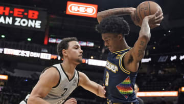Denver Nuggets guard Bones Hyland (3) is defended by San Antonio Spurs guard Bryn Forbes (7) during the second half at AT&T Center on 11 Dec. 2021. (Scott Wachter-USA TODAY Sports)