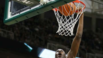 EAST LANSING, MI - DECEMBER 18: Jaren Jackson Jr. #2 of the Michigan State Spartans dunks over Tim Myles #12 of the Houston Baptist Huskies during the second half at the Jack T. Breslin Student Events Center on December 18, 2017 in East Lansing, Michigan. Michigan State won the game 107-62. (Photo by Gregory Shamus/Getty Images)