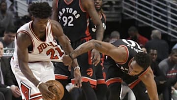Jan 7, 2017; Chicago, IL, USA; Chicago Bulls forward Jimmy Butler (21) and Toronto Raptors guard DeMar DeRozan (10) go for the ball during the second half at the United Center. The Bulls won 123-118 in overtime. Mandatory Credit: David Banks-USA TODAY Sports