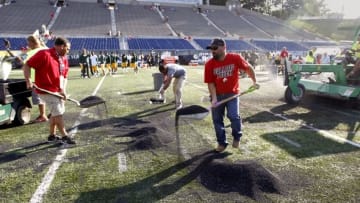 Aug 7, 2016; Canton, OH, USA; Field workers remove rubber pellets from the field before the NFL preseason game between the Green Bay Packers and Indianapolis Colts at Tom Benson Hall of Fame Stadium Mandatory Credit: Rick Wood/Milwaukee Journal Sentinel via USA TODAY Network