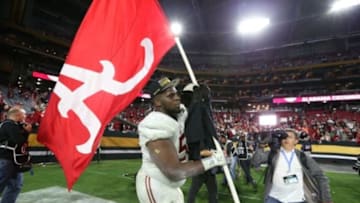 Jan 11, 2016; Glendale, AZ, USA; Alabama Crimson Tide offensive lineman Alphonse Taylor (50) celebrates their 45-40 over the Clemson Tigers in the 2016 CFP National Championship at University of Phoenix Stadium. Mandatory Credit: Matthew Emmons-USA TODAY Sports