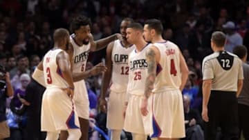 Jan 18, 2016; Los Angeles, CA, USA; Los Angeles Clippers players Chris Paul (3) and DeAndre Jordan (6), forward Luc Richard Mbah a Moute (12) and Austin Rivers (25) and J.J. Redick (4) huddle during an NBA basketball game against the Houston Rockets at Staples Center. The Clippers defeated the Rockers 140-132 in overtime. Mandatory Credit: Kirby Lee-USA TODAY Sports