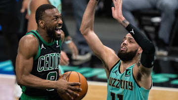 CHARLOTTE, NORTH CAROLINA - APRIL 25: Kemba Walker #8 of the Boston Celtics drives to the basket while being guarded by Cody Martin #11 of the Charlotte Hornets in the third quarter during their game at Spectrum Center on April 25, 2021 in Charlotte, North Carolina. NOTE TO USER: User expressly acknowledges and agrees that, by downloading and or using this photograph, User is consenting to the terms and conditions of the Getty Images License Agreement. (Photo by Jacob Kupferman/Getty Images)