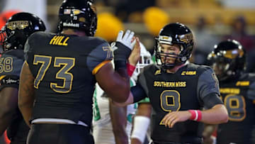 Oct 3, 2015; Hattiesburg, MS, USA; Southern Miss Golden Eagles quarterback Nick Mullens (9) greets offensive lineman Rashod Hill (73) after Mullens