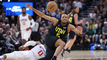 Oct 27, 2023; Salt Lake City, Utah, USA; Utah Jazz guard Talen Horton-Tucker (5) and Los Angeles Clippers guard Russell Westbrook (0) collide at center court in the fourth quarter at Delta Center. Mandatory Credit: Rob Gray-USA TODAY Sports